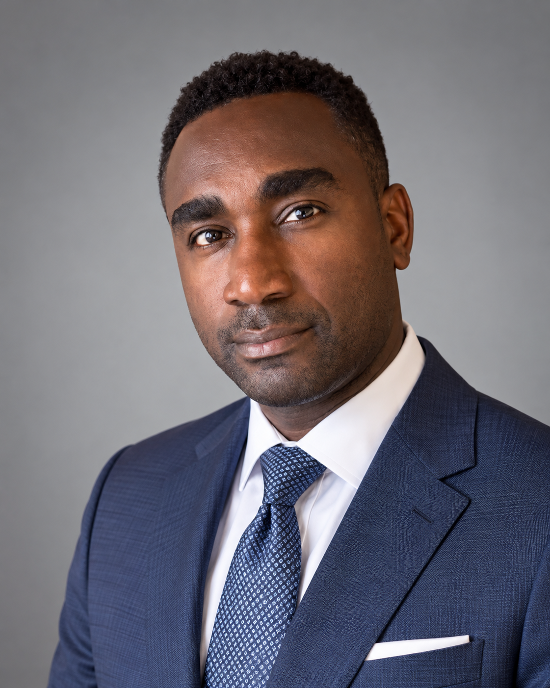 Jeffrey E. de Graft-Johnson wearing a navy suit and blue tie